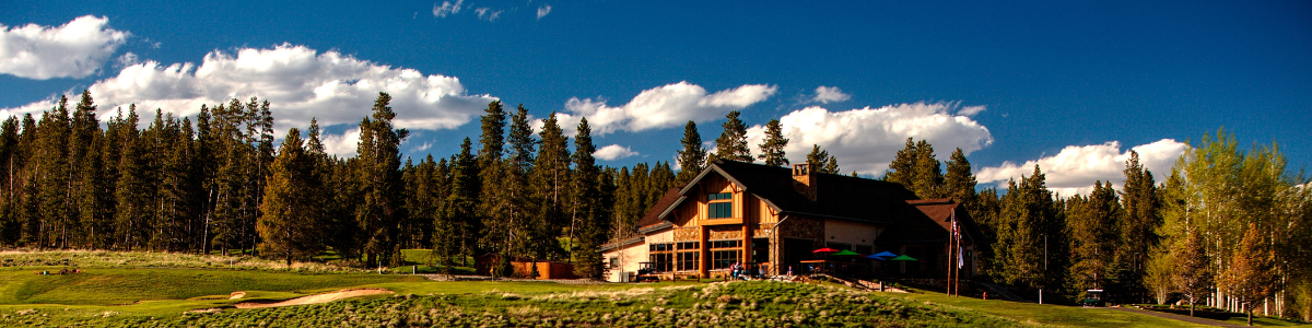 Pole Creek Golf Club Clubhouse with a blue sky and a view of the Ranch hole 9 Green.